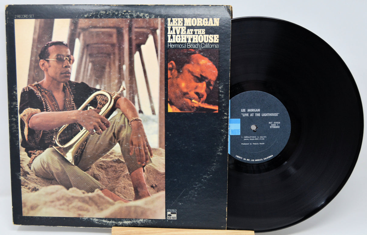 Vinyl record and cover featuring Lee Morgan with a trumpet, on a light gray background