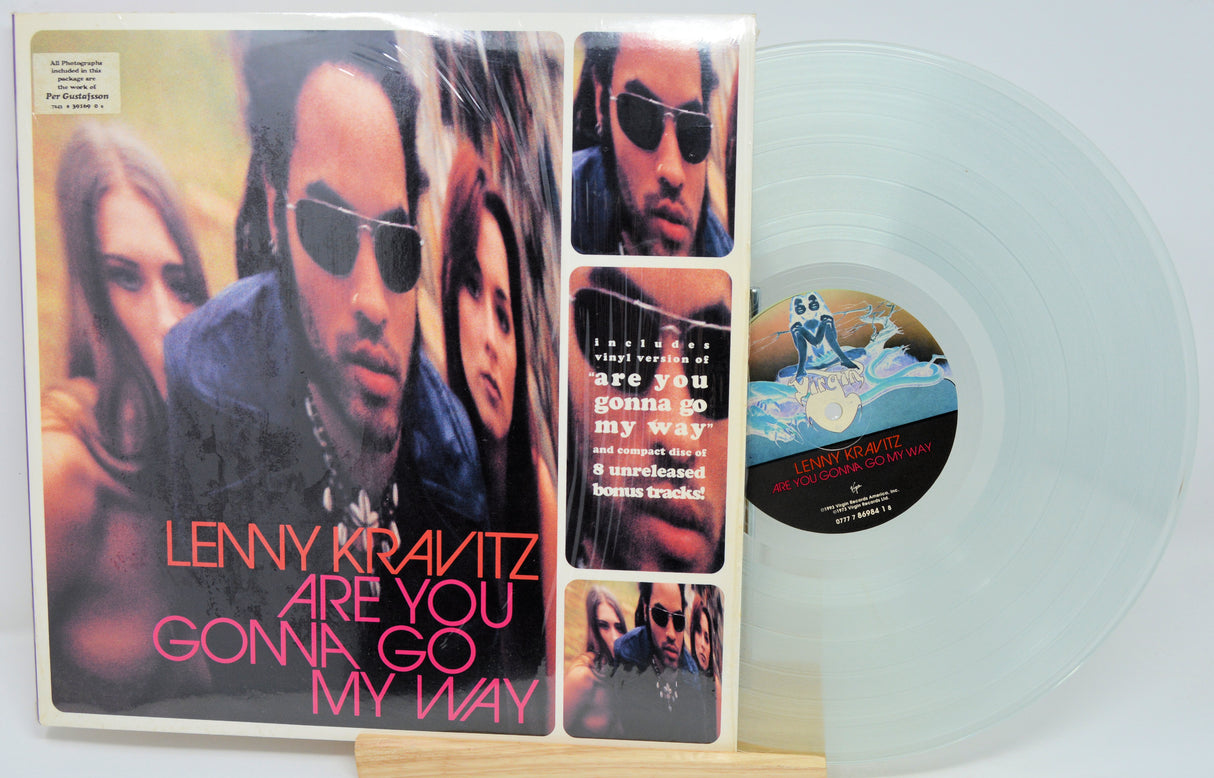 Vinyl record with cover featuring a collage of images and text, including 'Lenny Kravitz: Are You Gonna Go My Way'.