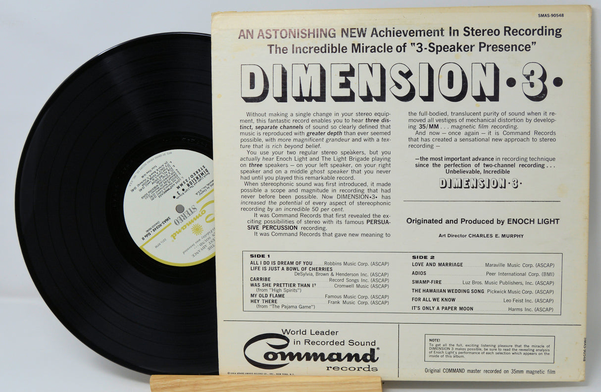 Vinyl record with its cover displaying text about stereo recording technology on a light gray background.