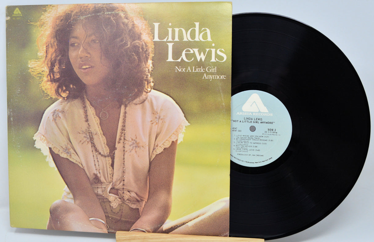 Vinyl record with cover featuring a woman, titled 'Not A Little Girl Any More' by Linda Lewis.