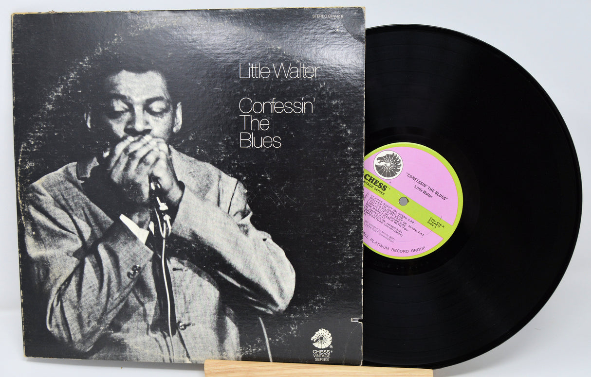 Vinyl record with cover featuring a musician and 'Little Walter Confessin' The Blues' text.