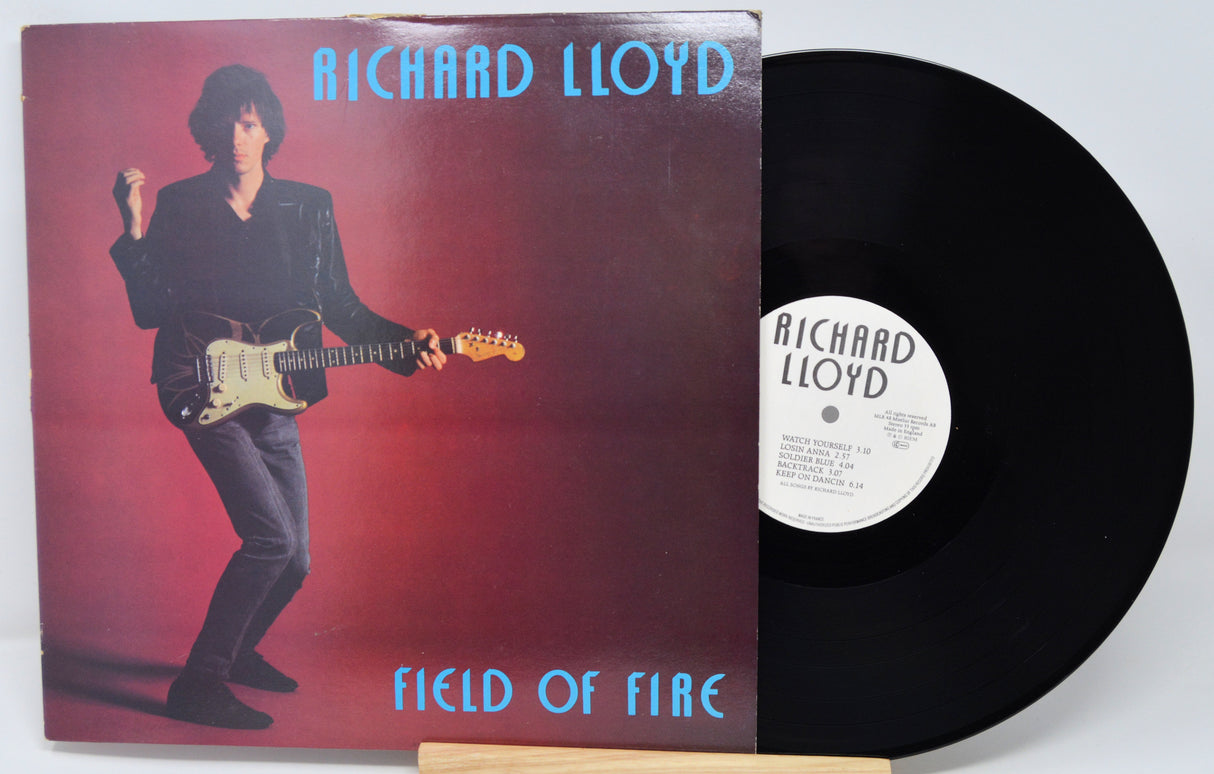 Vinyl record with cover featuring a musician and 'Richard Lloyd Field of Fire' text