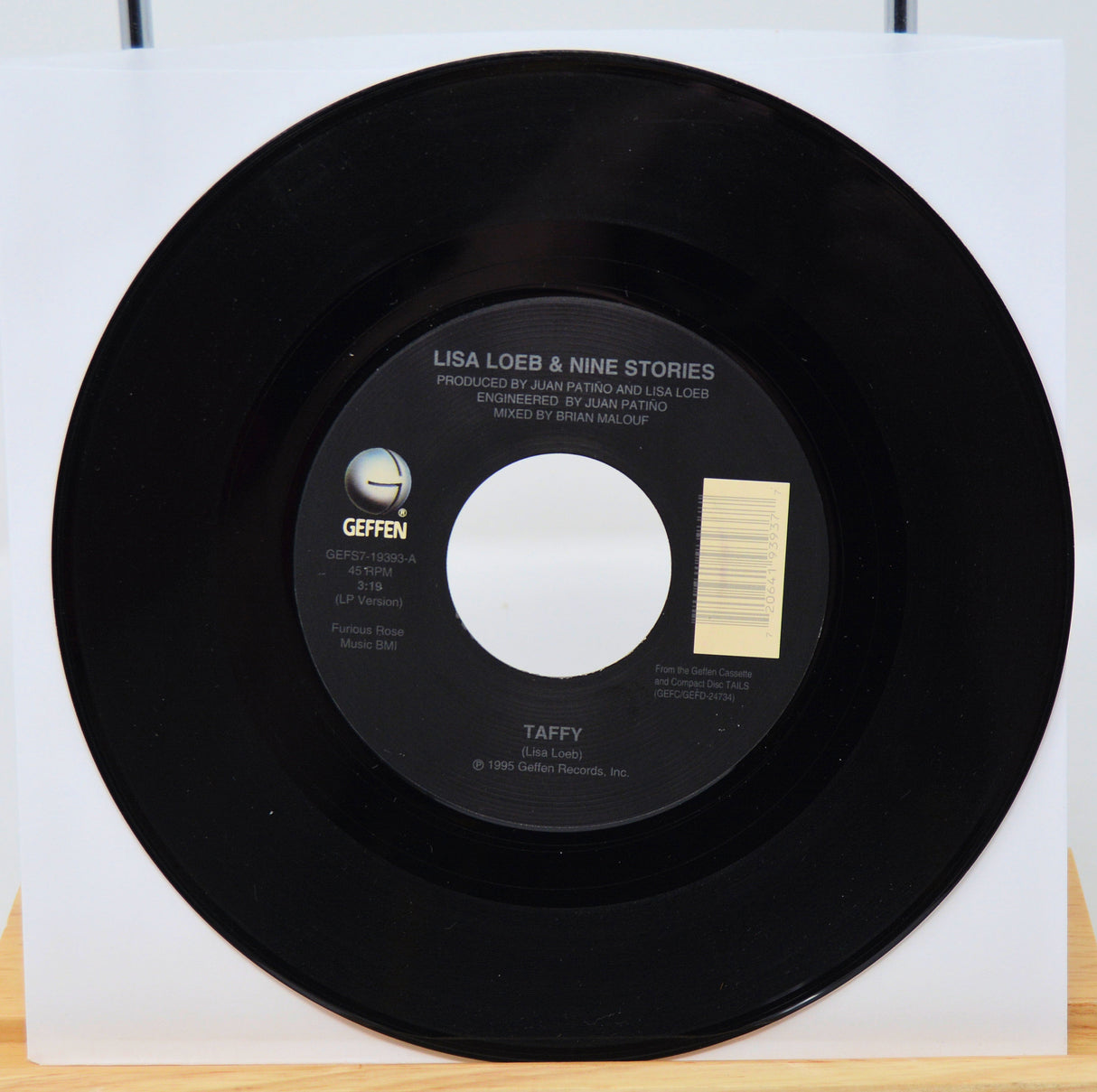 Vinyl record with a white label on a white background