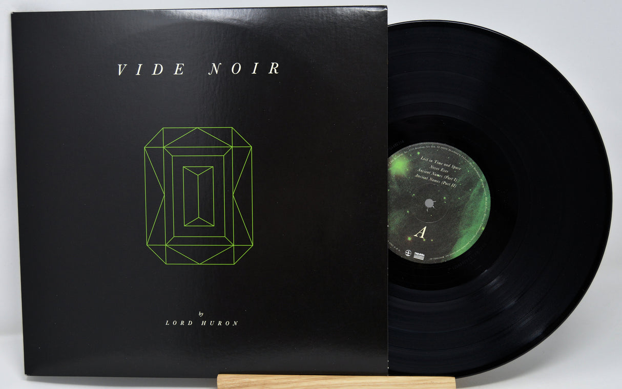 Vinyl record with cover titled 'Vide Noir' on a white background