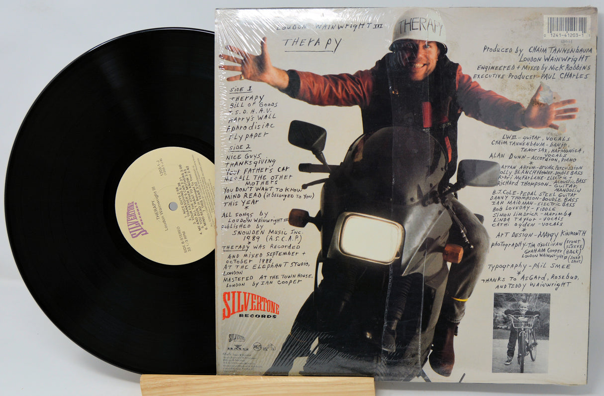 Vinyl record with a motorcycle-themed cover featuring a person on a bike.