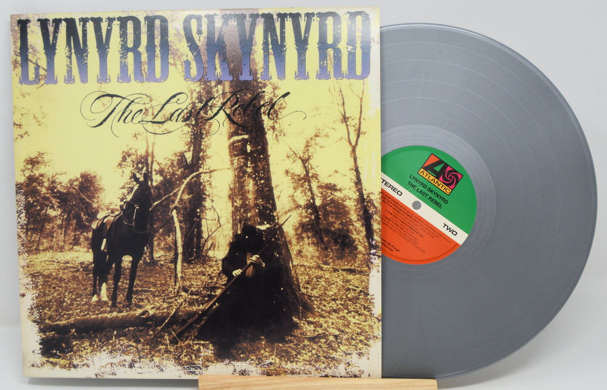 Front cover and silver vinyl LP of Lynyrd Skynyrd's The Last Rebel album, horseback scene artwork