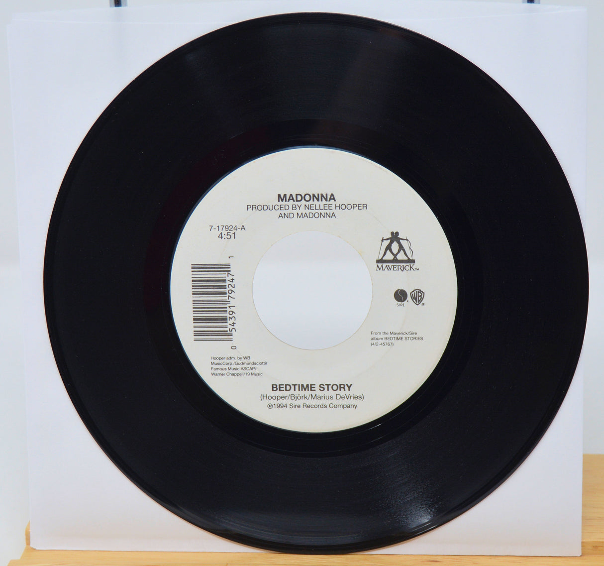Vinyl record with label on a white background