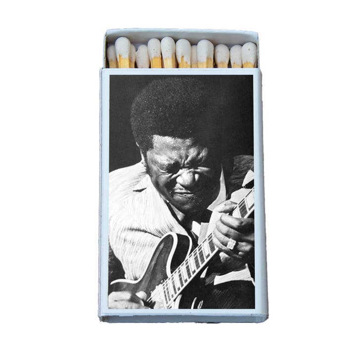 Matchbox with black and white photo of soulful blues guitarist playing electric guitar