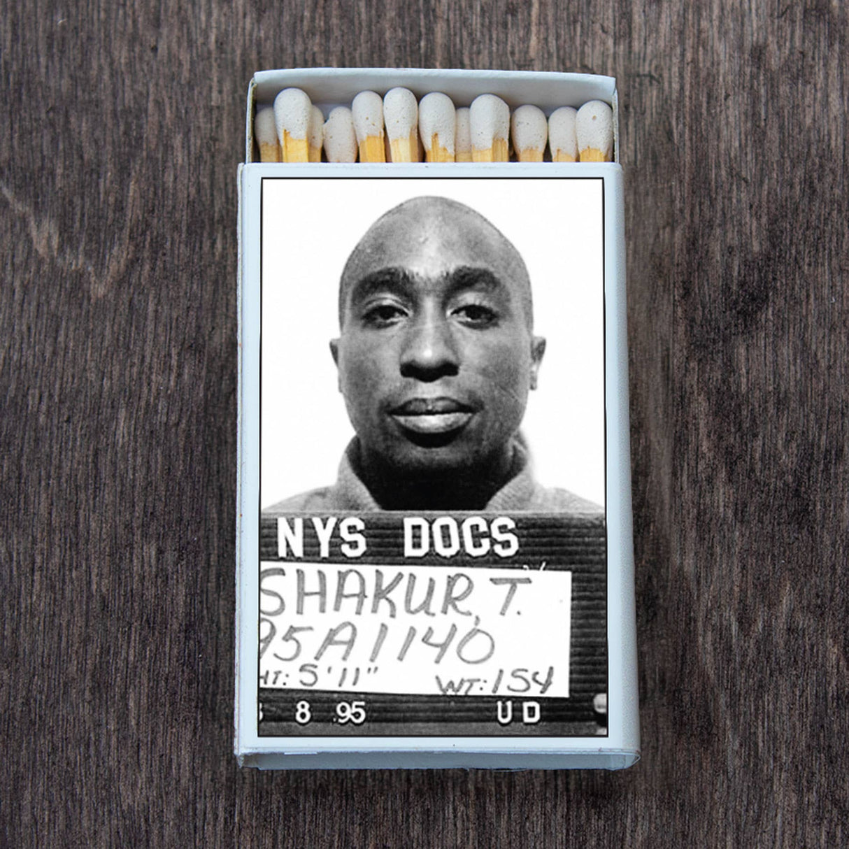 Box of matches with iconic black and white mugshot photo on the cover