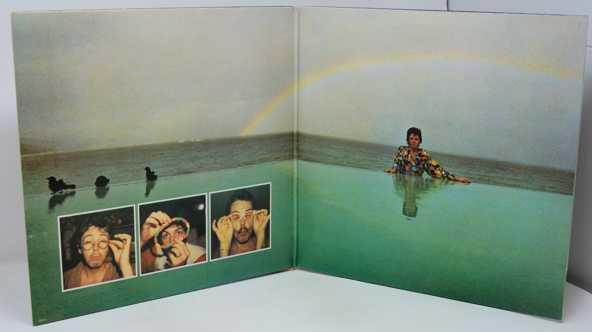 Album cover with a person in water and small portraits on a green background
