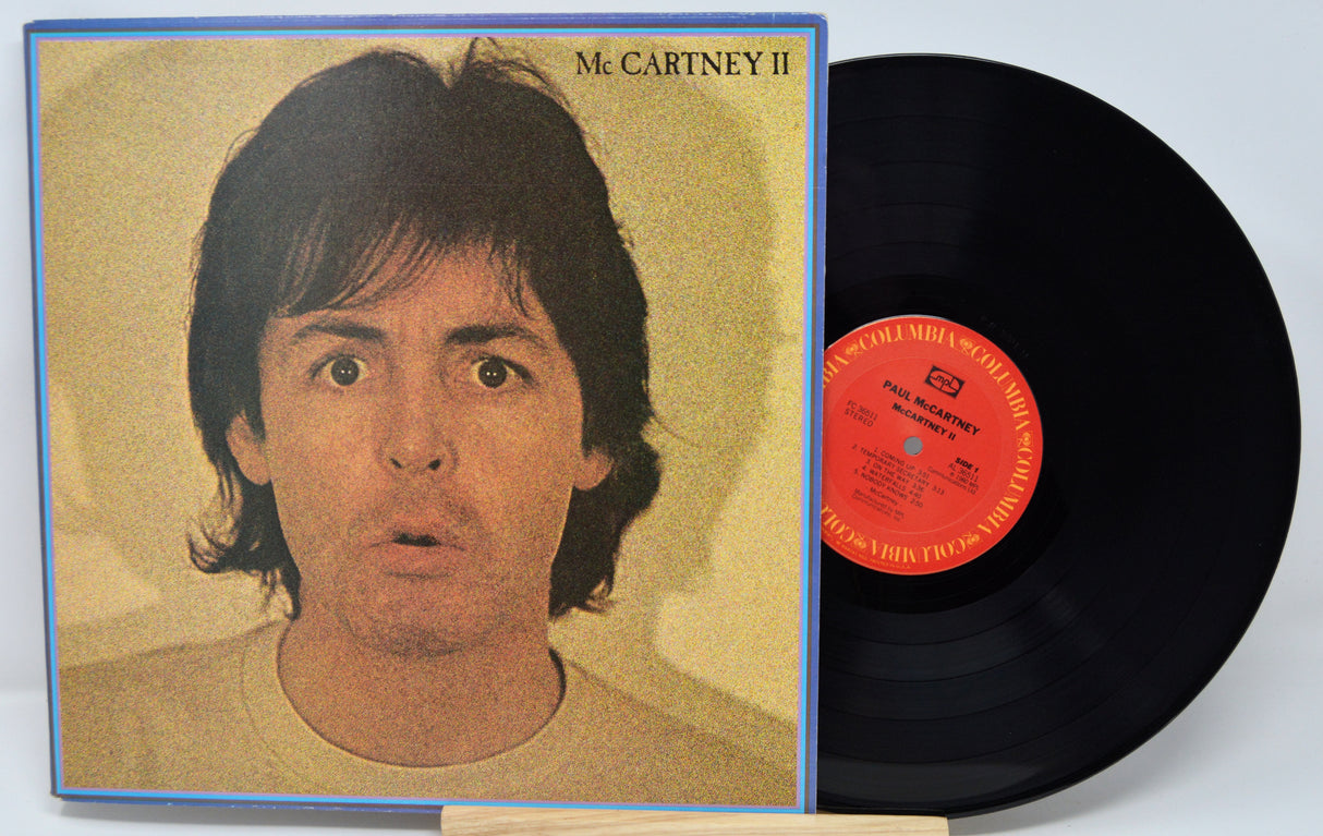 Vinyl record with cover featuring a person's face, labeled 'McCartney II'.