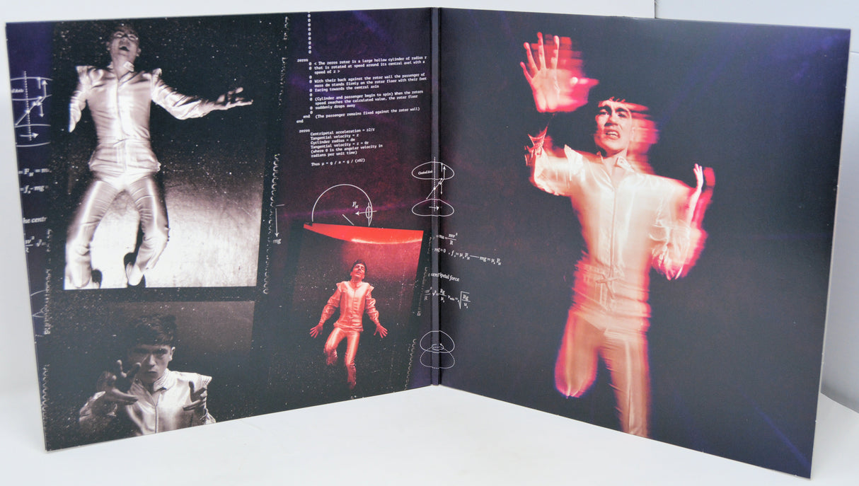 Open book with black and white and red images of a person in a suit on a dark background