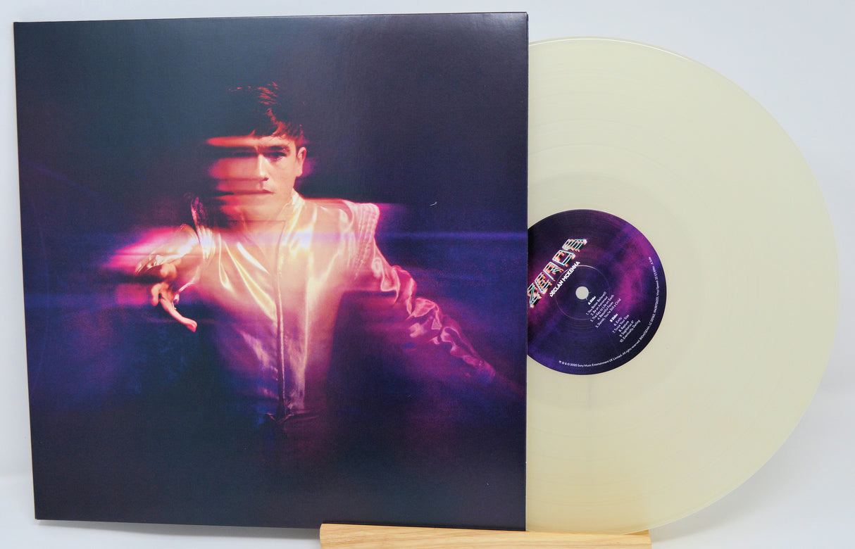 Vinyl record with a cover featuring a person and a clear vinyl disc.