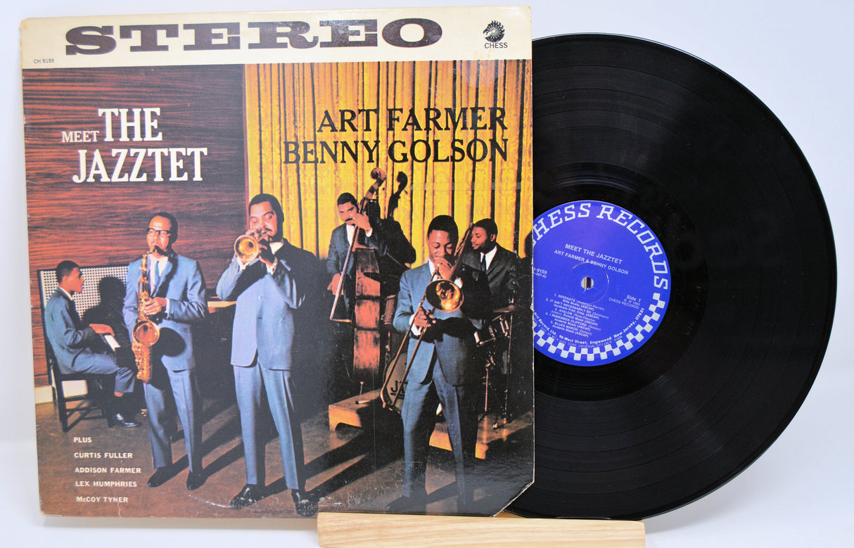 Front cover of 'Meet the Jazztet' vinyl LP by Art Farmer & Benny Golson with band members in blue suits