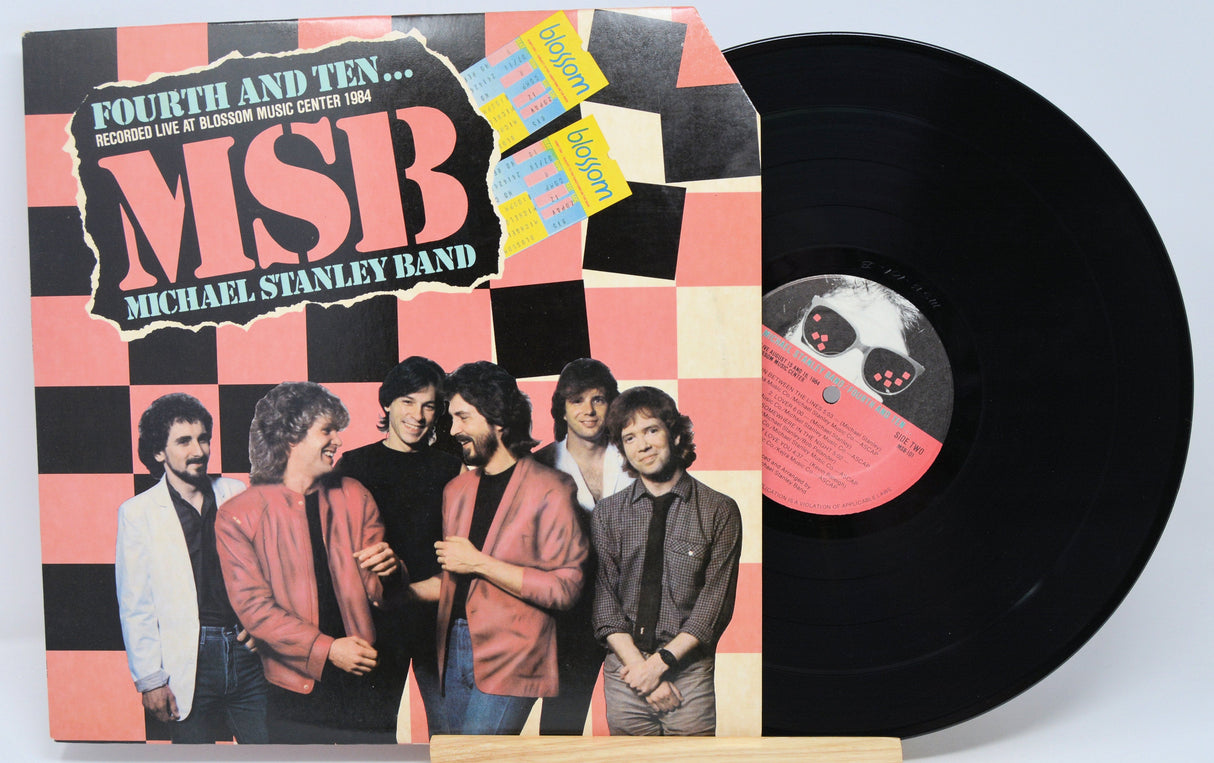 Front cover of Michael Stanley Band's Fourth and Ten vinyl LP featuring the band and checkered design