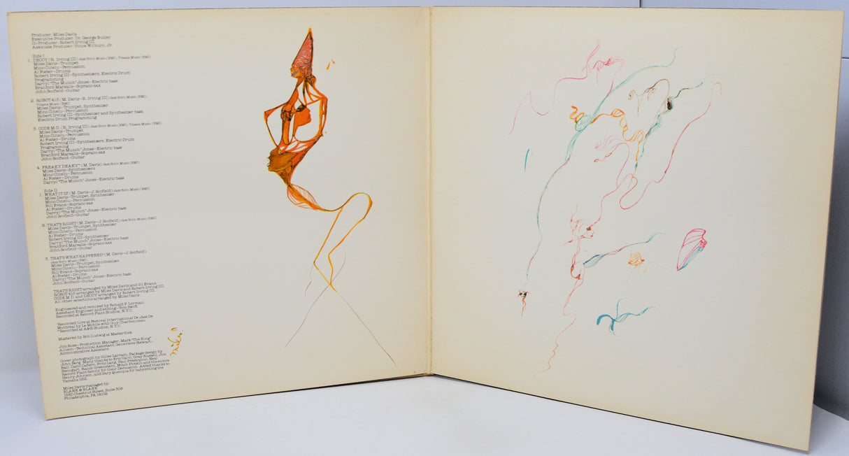 Open book with artistic illustrations of a dancer and abstract shapes on a light background.