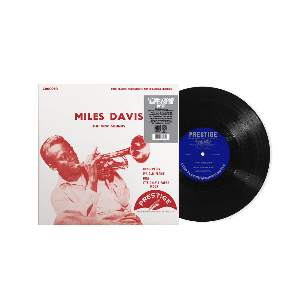 Vinyl record and cover featuring Miles Davis on a white background