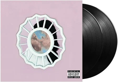 The image displays the vinyl record album cover for "The Divine Feminine" by Miller, Mac. The cover art features a minimalist design with a central, circular image of a cloudy sky within a white, sunburst pattern that extends outward to a solid pink background.