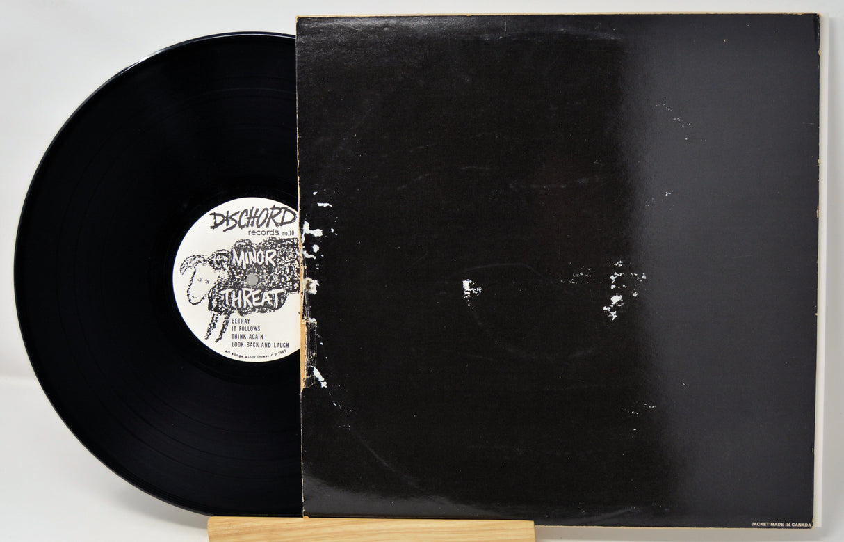 Vinyl record with a visible label on a white background