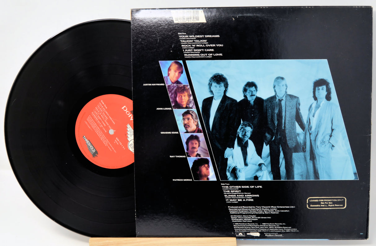 Vinyl record with cover featuring a group of people on a white background