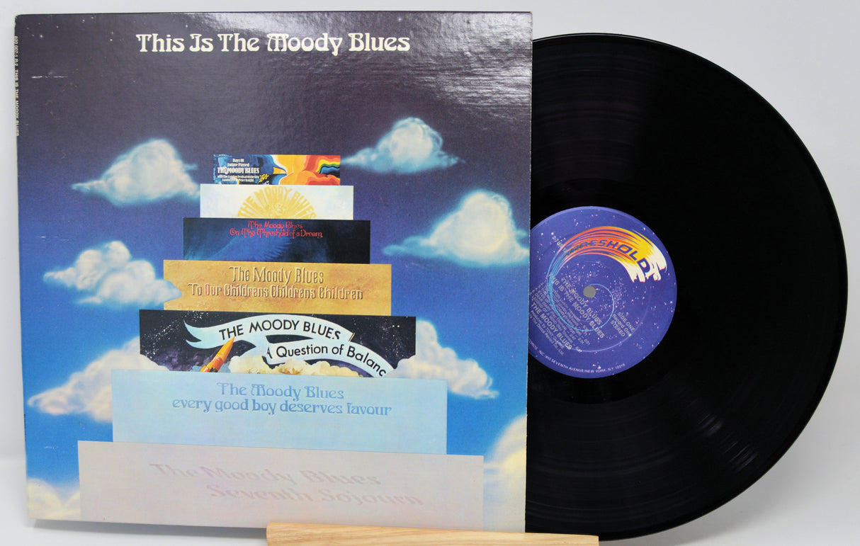 Vinyl record and cover with 'This Is The Moody Blues' on a white background