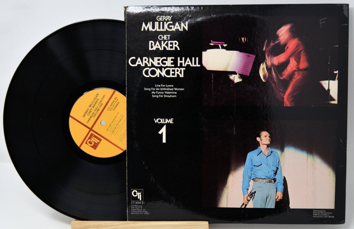 Vinyl record album for Gerry Mulligan and Chet Baker's Carnegie Hall Concert Volume 1, showing the black LP disc partially pulled from the sleeve against a white background.