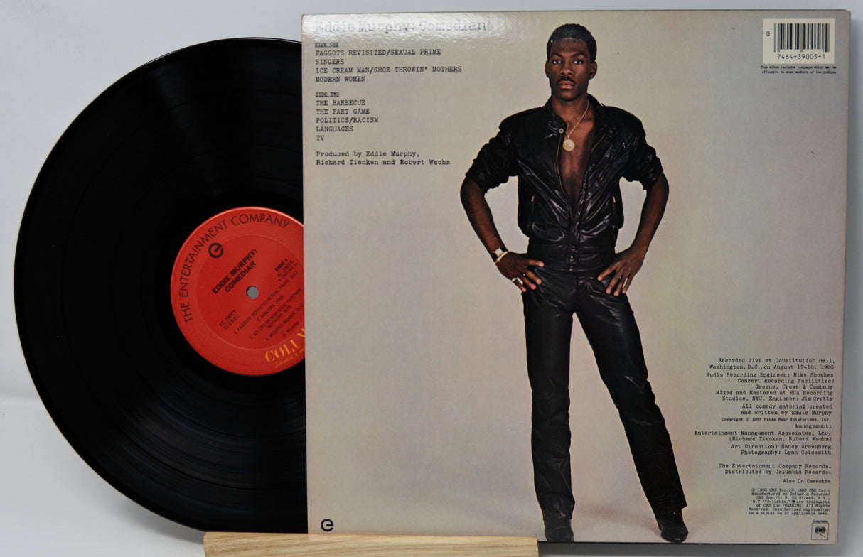 Vinyl record with a person on the cover and a red label