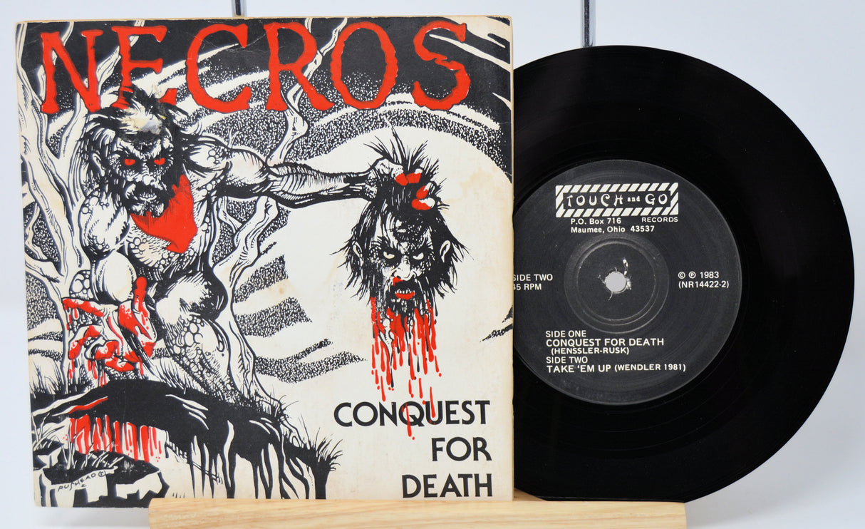 Vinyl record with cover featuring artistic design and text on a white background