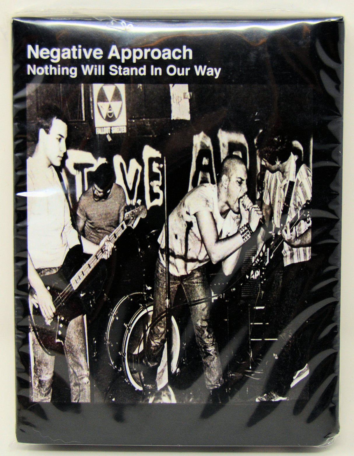 Front cover of Negative Approach's 'Nothing Will Stand In Our Way' featuring a live punk band performance