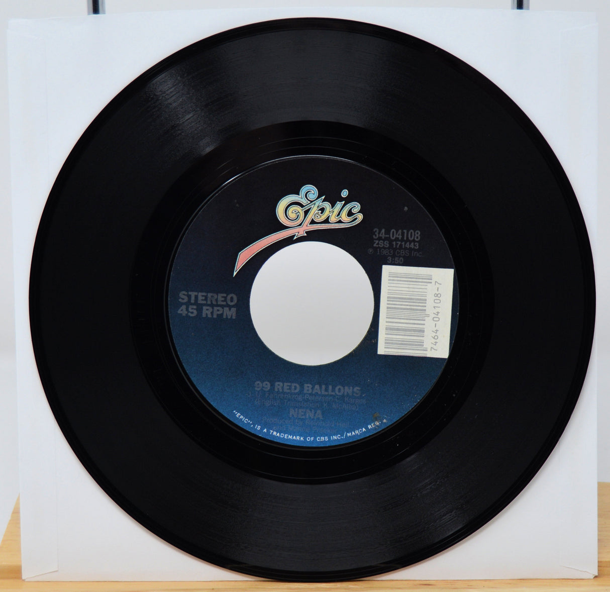 Black vinyl record with Epic label on a white background