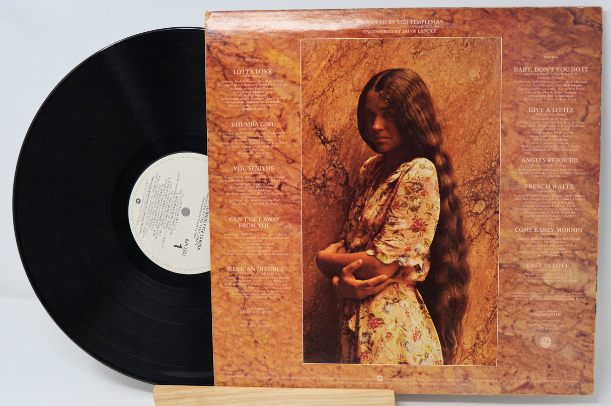 Vinyl record with a cover featuring an image of a person and text on a light gray background