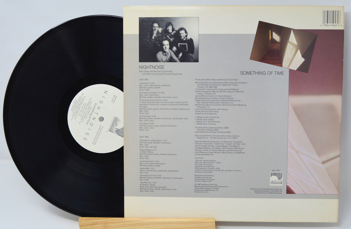 Back cover and vinyl record of Nightnoise's album Something of Time featuring track list and artist photo