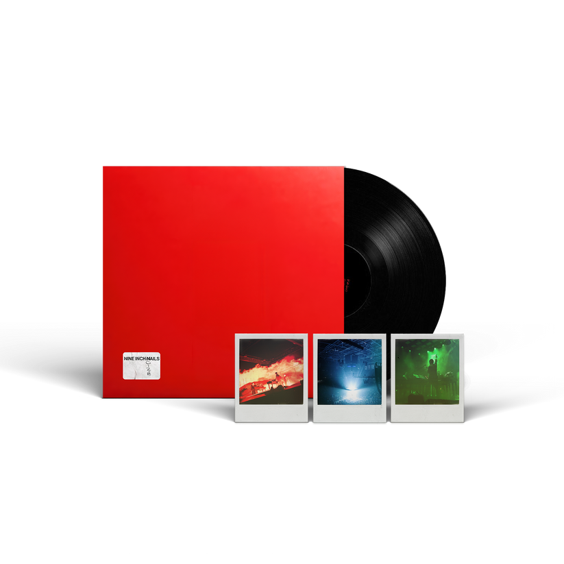 A vinyl record package on a white background, featuring a large red sleeve, a partially visible black record, and three small instant-style photo prints in front.