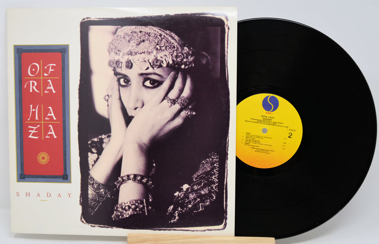 Vinyl record with a cover featuring a woman's portrait and album details.