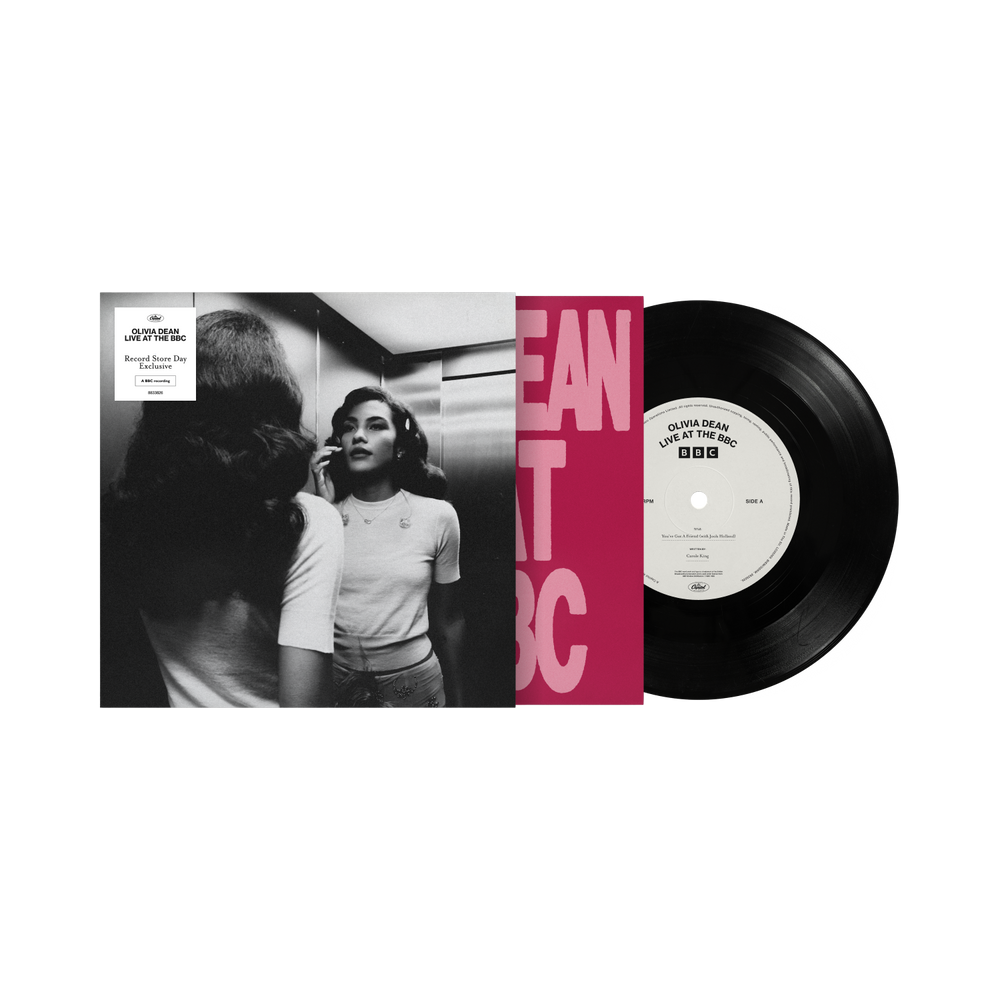 Vinyl record with a black and white photo and red text on the cover