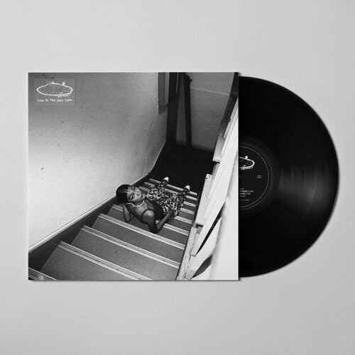 A vinyl record titled 'Olivia Dean - Live At The Jazz Café' with a black and white image of an artist performing on the cover.