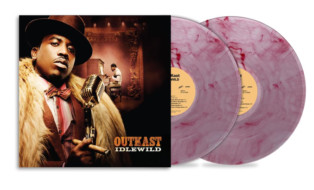 Outkast - Idlewild vinyl record album with the illustrated cover on the left and two translucent marbled pink-purple records on the right, shown on a white background.