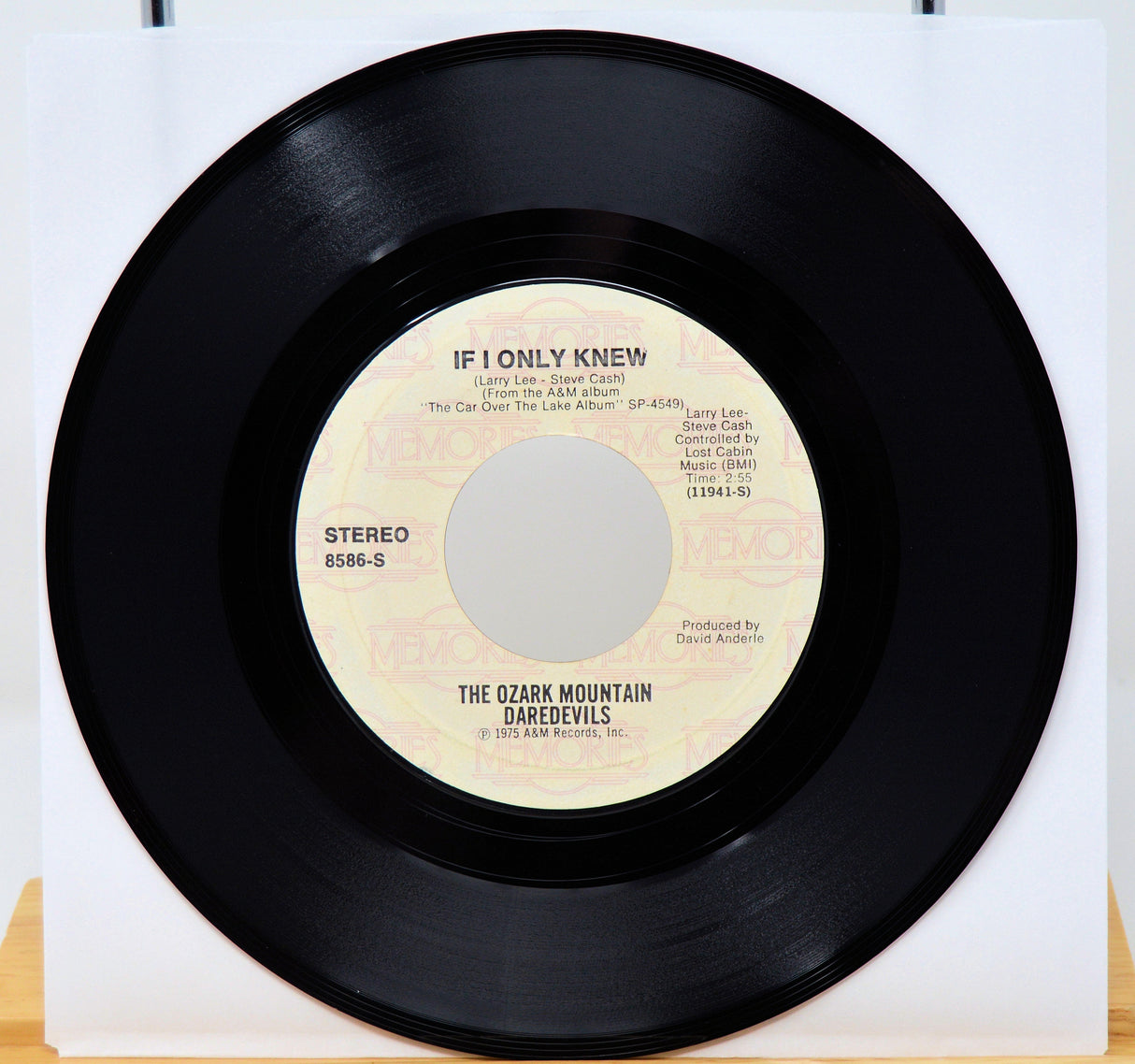 Vinyl record with 'If I Only Knew' by The Ozark Mountain Daredevils on a white background