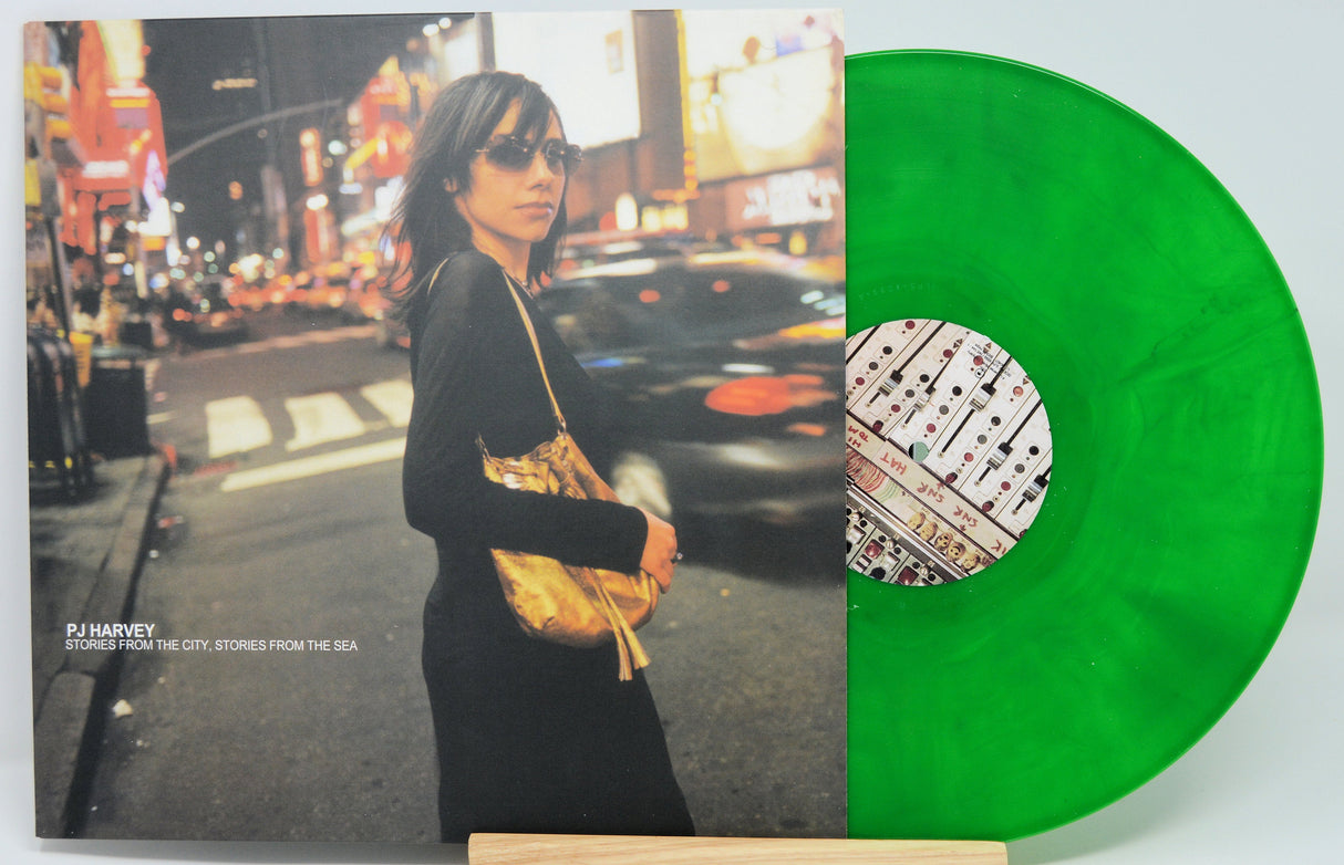 Front cover of PJ Harvey's Stories From the City, Stories From the Sea album with PJ Harvey in New York and translucent green vinyl