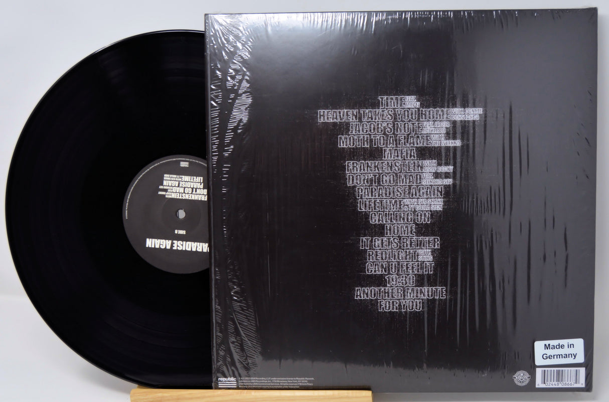 Back cover and vinyl record of Swedish House Mafia's Paradise Again LP featuring tracklist