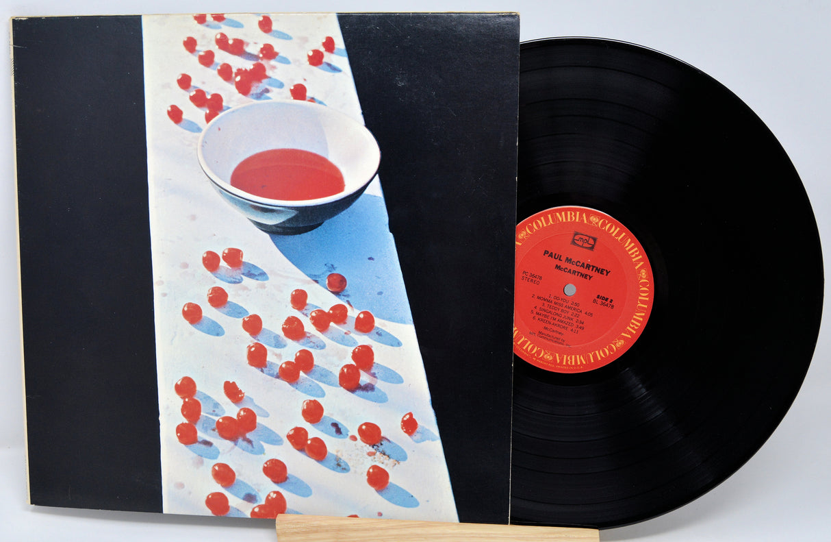 Vinyl record with a colorful cover featuring bowls of red and blue substances.