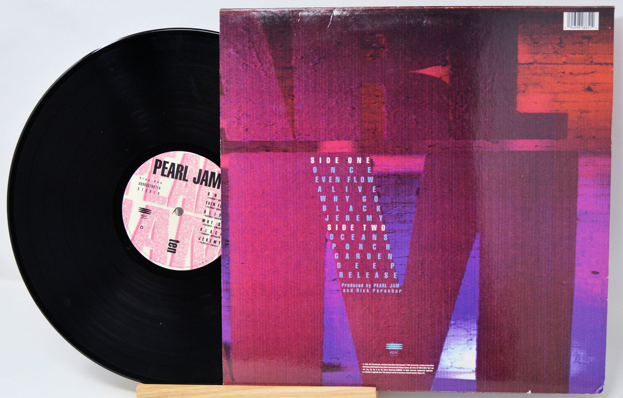 Vinyl record with a colorful cover and visible label on a white background