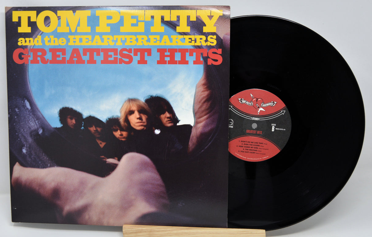 Vinyl record with 'Tom Petty and the Heartbreakers Greatest Hits' cover on a white background