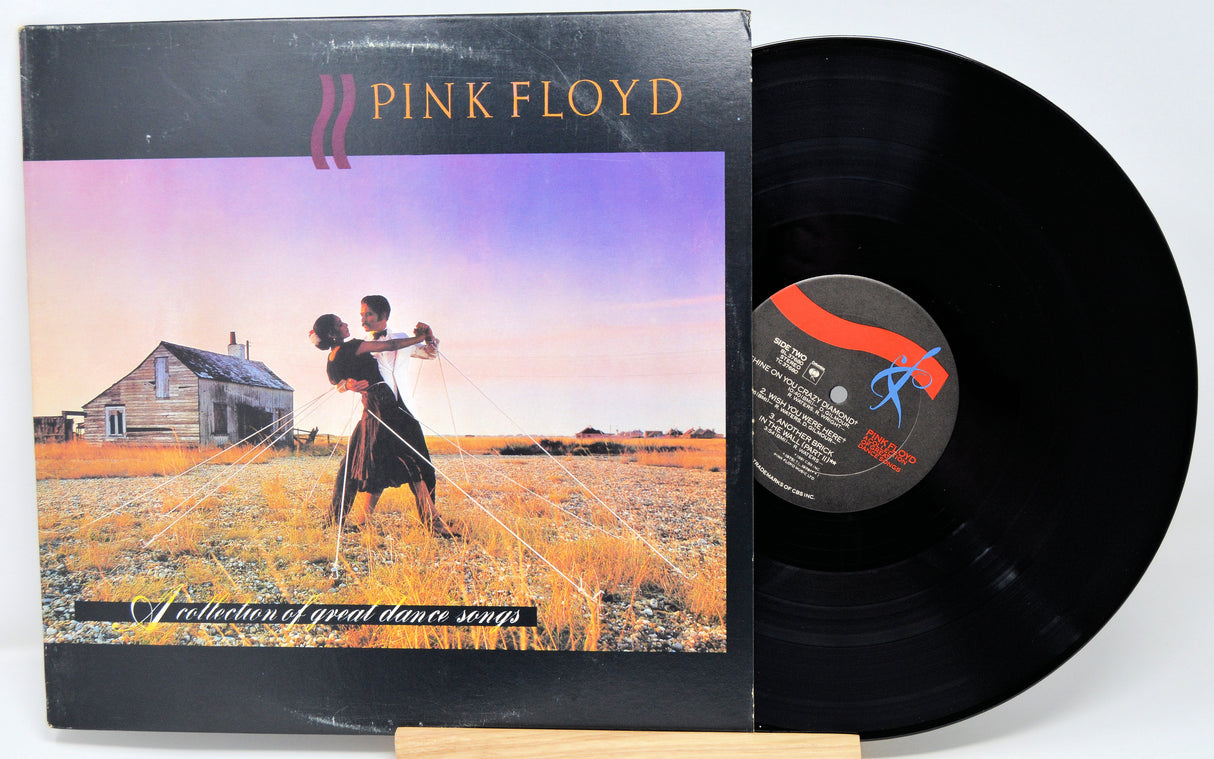 Pink Floyd vinyl record with cover showing two people dancing in a field.