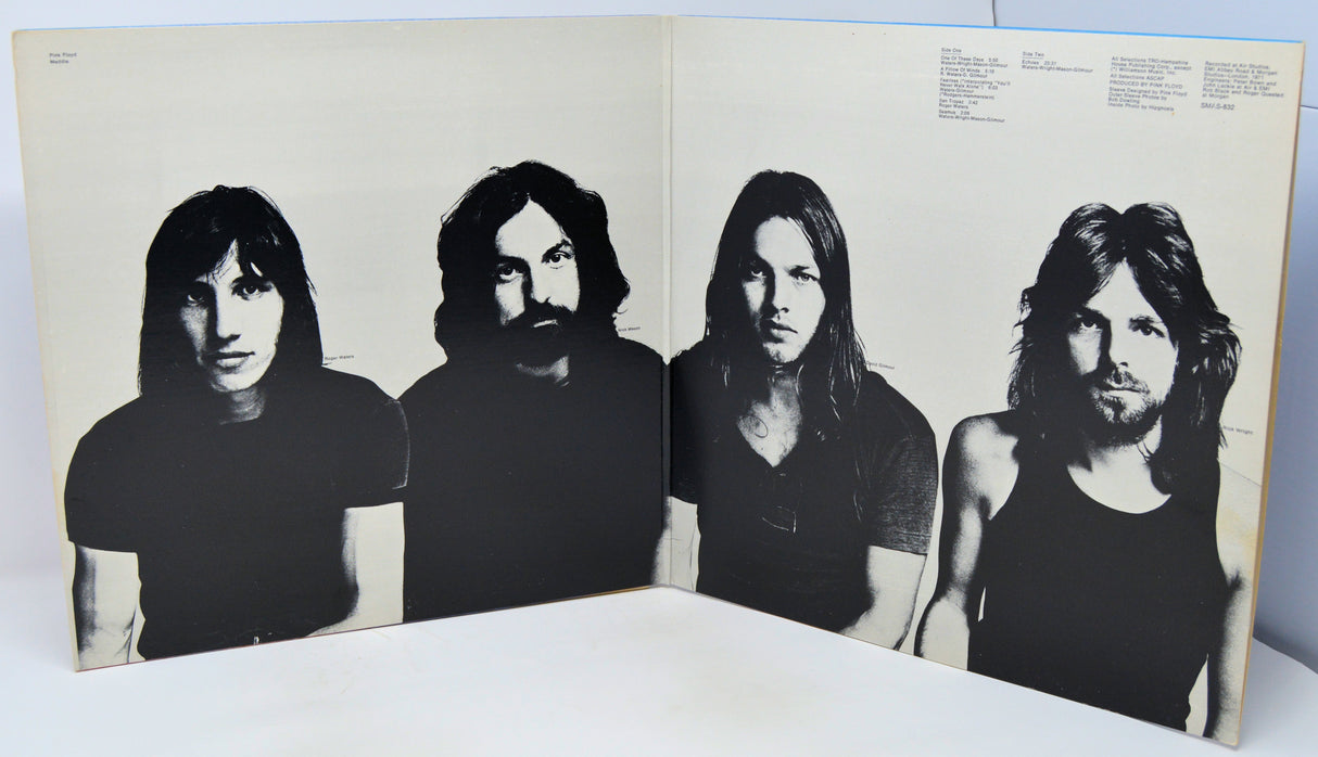 Album cover with black and white portraits of four band members on a beige background