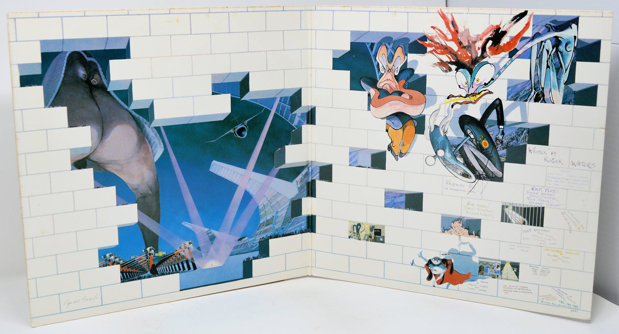 Mosaic artwork with abstract designs on a tiled wall