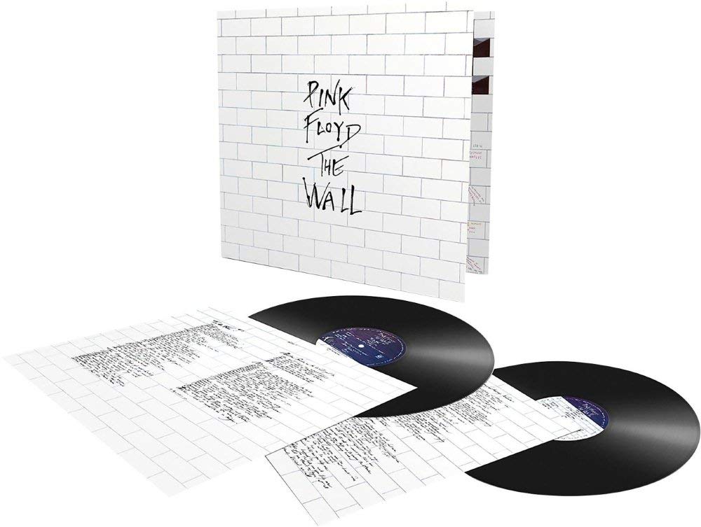 A vinyl record of Pink Floyd - The Wall with a white background and black text including the album title and band name.