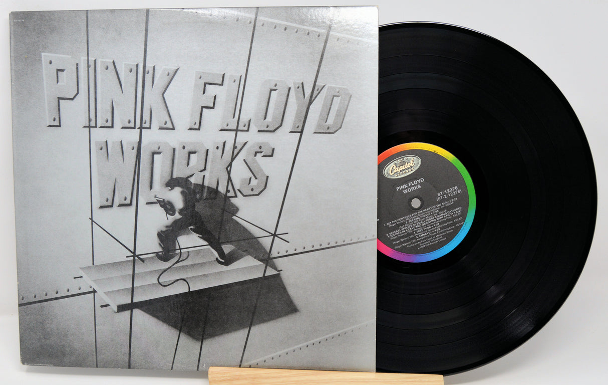 Vinyl record with cover featuring a man by a waterfront, 'Eric Clapton' album text.