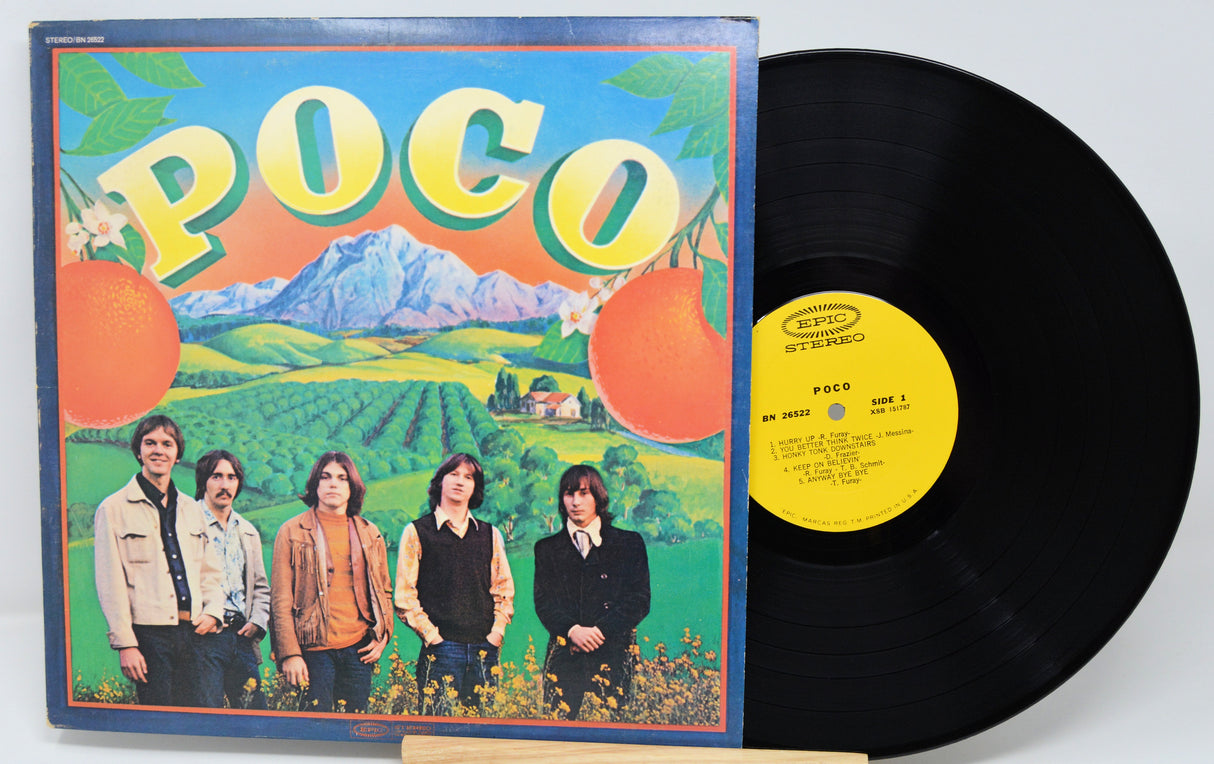 Vinyl record and cover with 'Poco' band members on a scenic background