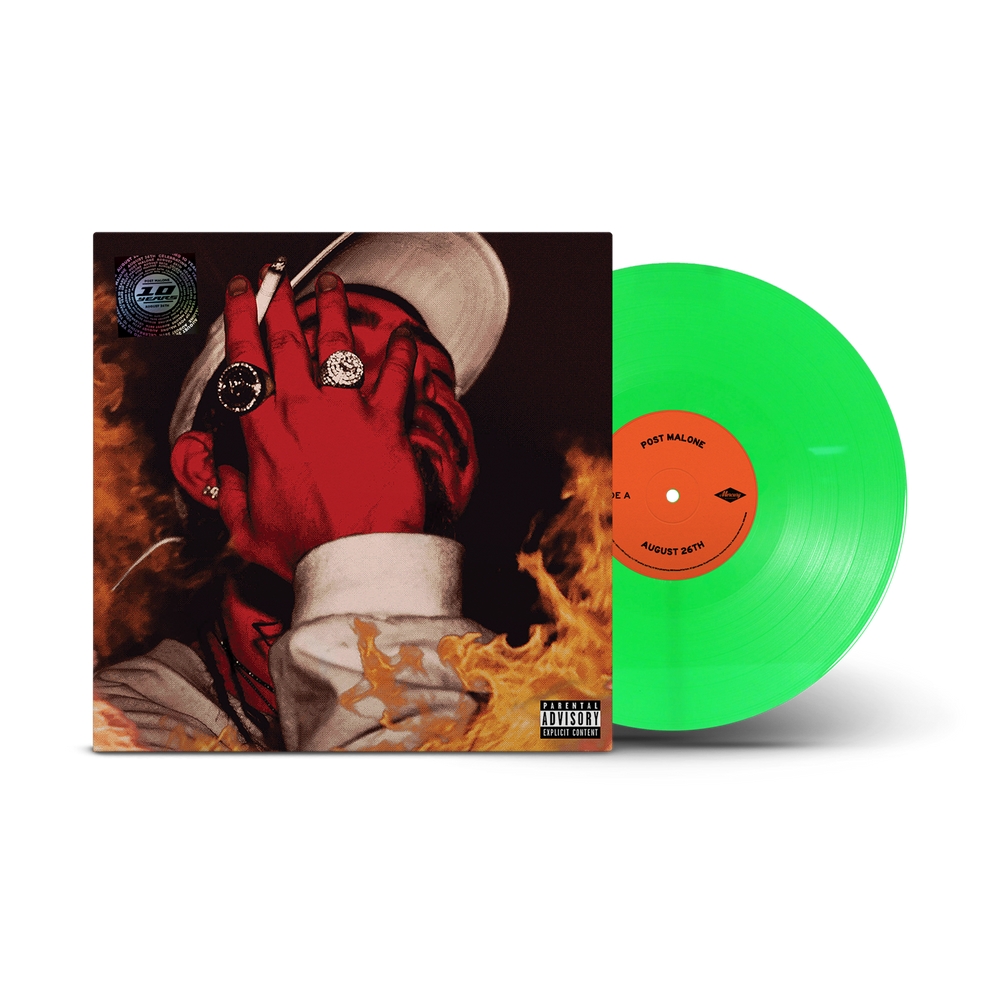 A vinyl record album shown with its illustrated cover sleeve and a bright translucent green record partially visible. The sleeve features a stylized portrait with red tones, white hat, and orange flames.